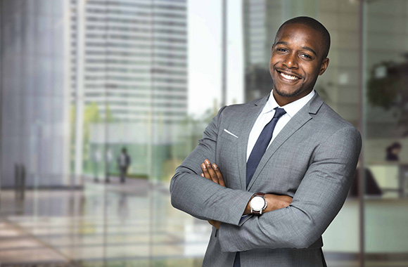 Business man in front of an office building
